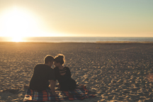 Couple sitting on beach